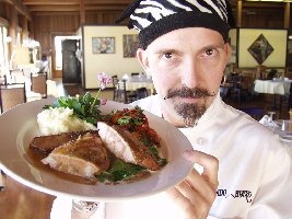Photo of Nicholas Petti holding a plate of turkey